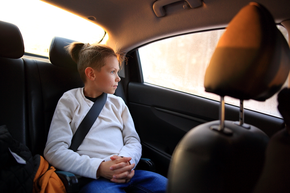 a young guy wearing a seat belt